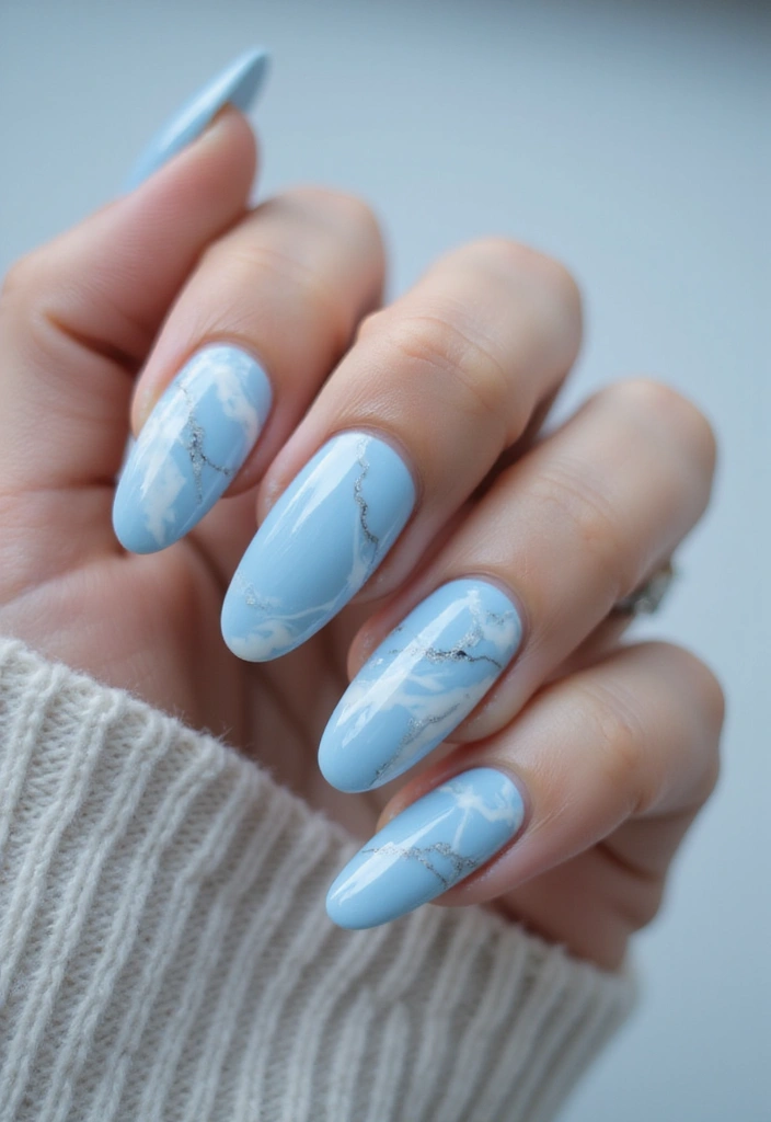28 Soft Light Blue Nail Ideas for Pastel - 7. Soft Blue Marble Effect